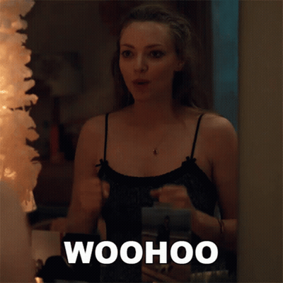 Woman Standing In Front Of Mirror Saying Woohoo GIF