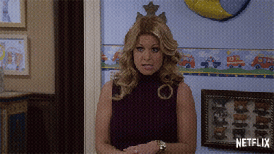 Woman Standing In Front Of Netflix Wall GIF