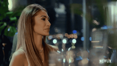 Woman Standing In Front Of Netflix Window GIF
