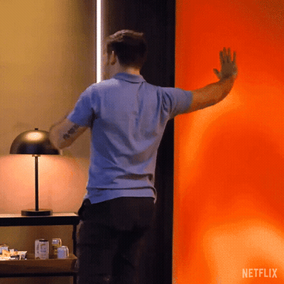 Woman Standing In Front Of Netflix Window GIF