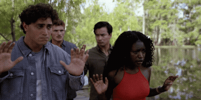 Woman Standing In Front Of Poster Of Woman GIF