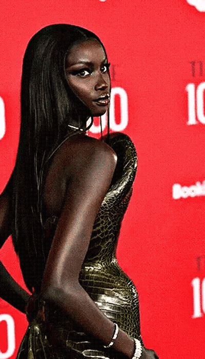 Woman Standing In Front Of Red Background With Number 10 GIF