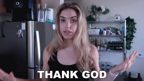 Woman Standing In Front Of Refrigerator Saying Thank God GIF