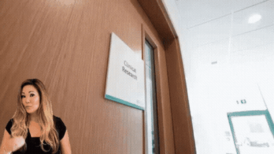 Woman Standing In Front Of Research Door GIF