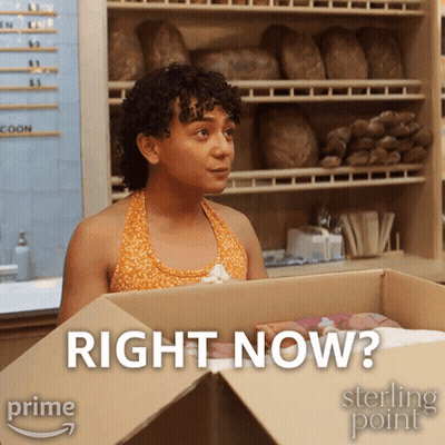 Woman Standing In Front Of Right Now Box GIF