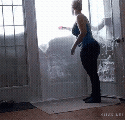 Woman Standing In Front Of Snow-Covered Door GIF