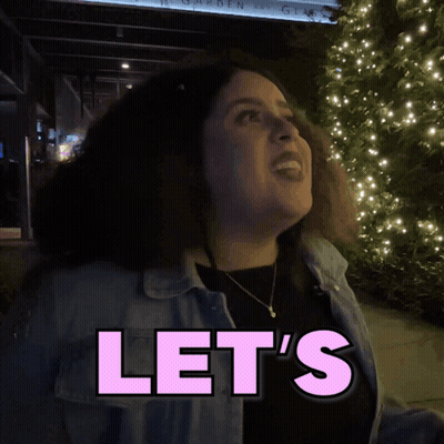 Woman Standing In Front Of Some Sign GIF