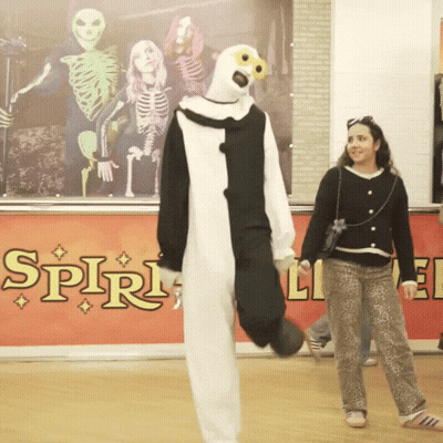 Woman Standing In Front Of Spirit Sign GIF