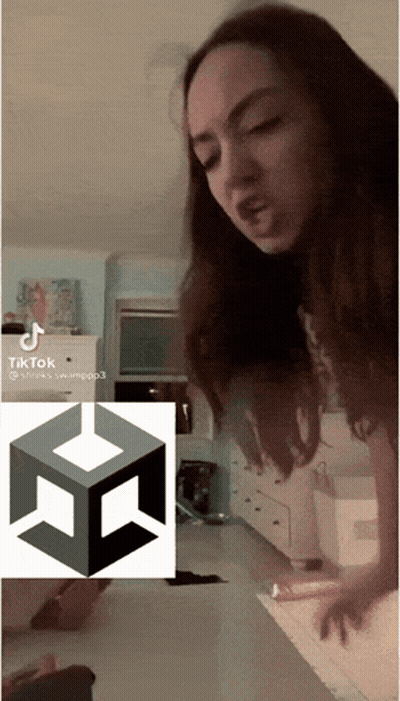 Woman Standing In Front Of TikTok Icon GIF