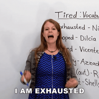 Woman Standing In Front Of Tired Sign GIF