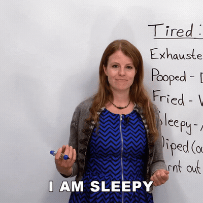 Woman Standing In Front Of Tired Sign GIF