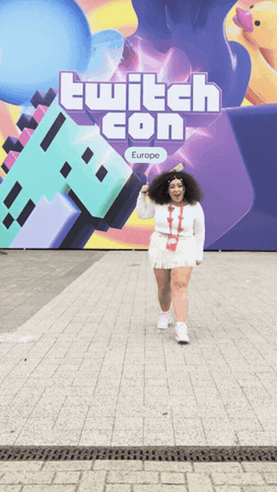 Woman Standing In Front Of Twitch Con Europe Sign GIF
