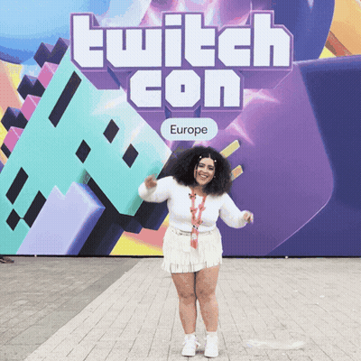 Woman Standing In Front Of Twitch Con Sign GIF