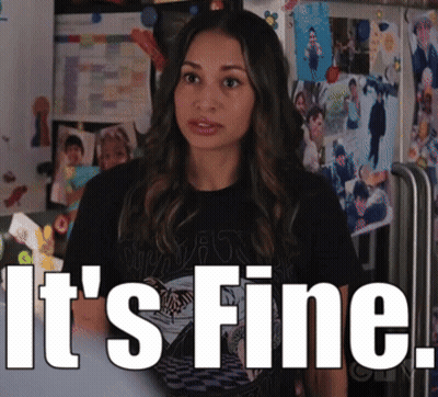 Woman Standing In Front Of Wall Saying Its Fine GIF