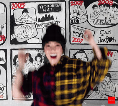 Woman Standing In Front Of Wall With Drawings 2005 GIF