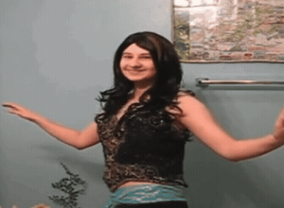 Woman Standing In Front Of Wall With Picture GIF