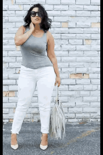 Woman Standing In Front Of White Brick Wall Sticker