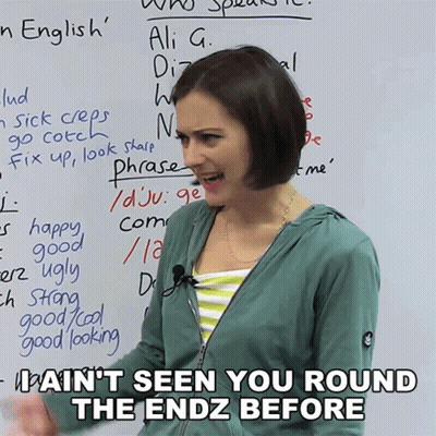 Woman Standing In Front Of Whiteboard With Phrases GIF