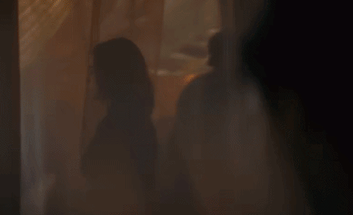Woman Standing In Front Of Window GIF
