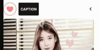 Woman Standing In Front Of Window With Caption Button GIF