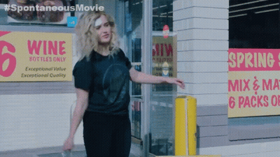 Woman Standing In Front Of Wine Store GIF