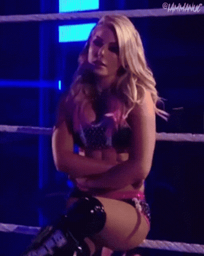 Woman Standing In Front Of Wrestlemania Backlash Sign GIF