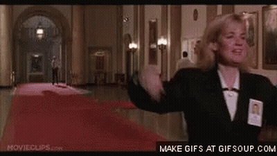 Woman Standing In Hallway Arms Outstretched GIF