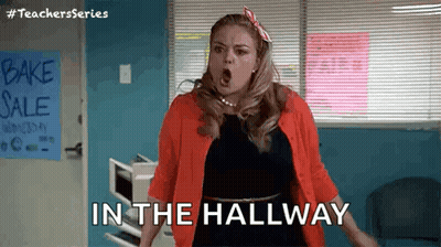 Woman Standing In Hallway With Open Mouth GIF