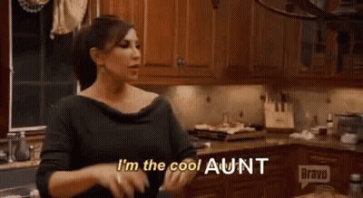 Woman Standing In Kitchen Talking GIF