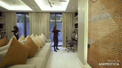 Woman Standing In Living Room GIF