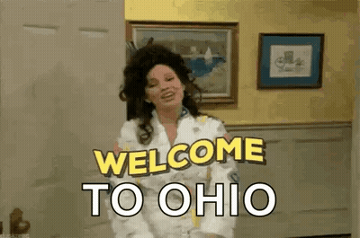 Woman Standing In Living Room Saying Welcome To Ohio GIF