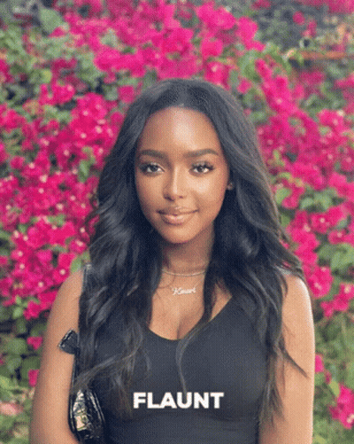 Woman Standing In Pink Flowers Flaunt GIF
