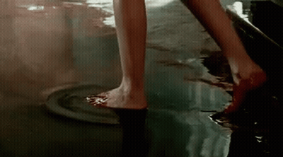 Woman Standing In Pool Of Blood GIF