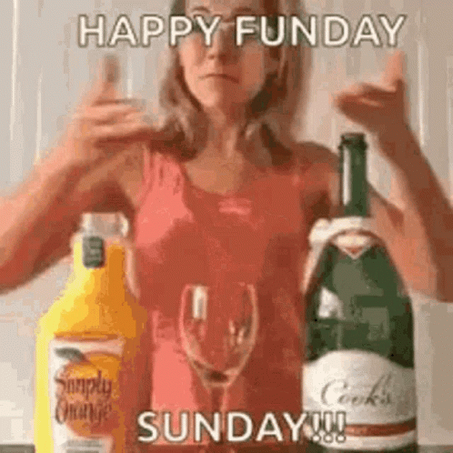 Woman Standing Near Orange Juice And Wine GIF