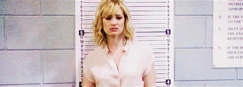 Woman Standing Next To 7 Inch Ruler GIF