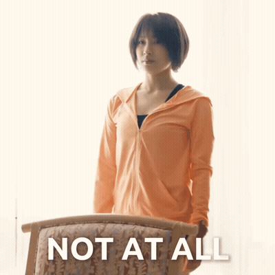 Woman Standing Next To Chair Saying Not At All GIF