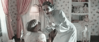 Woman Standing Next To Child In Pink Curtains GIF