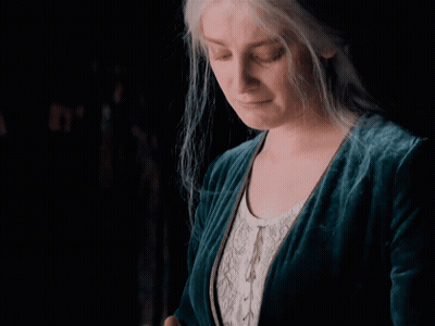 Woman Standing Next To Couch Saying Ech Leave Me Alone GIF
