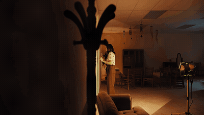 Woman Standing Next To Couch GIF