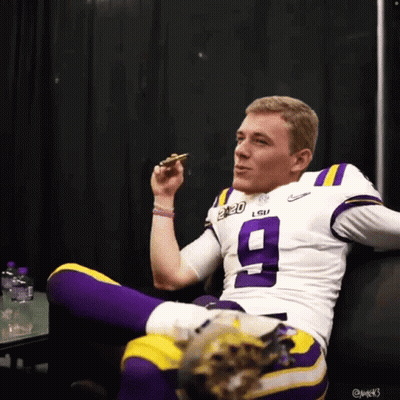 Woman Standing Next To Man On Knees In Front Of TV GIF