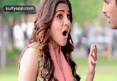 Woman Standing Next To Man With Mouth Open GIF