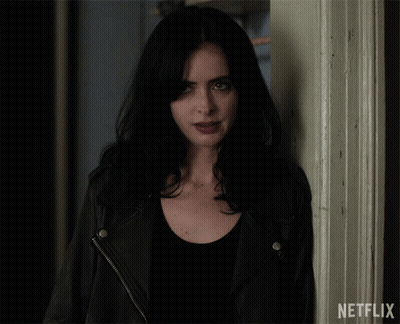 Woman Standing Next To Netflix Door GIF