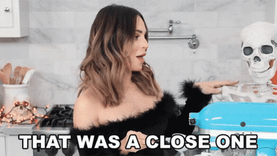 Woman Standing Next To Skeleton That Was A Close One GIF