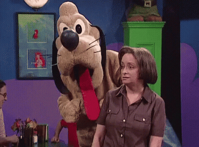 Woman Standing Next To Stuffed Dog With Long Tongue GIF