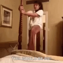 Woman Standing On Bed Holding Pole GIF