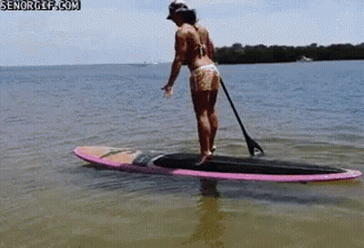 Woman Standing On Paddle Board GIF