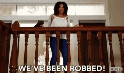 Woman Standing On Railing Saying We've Been Robbed GIF