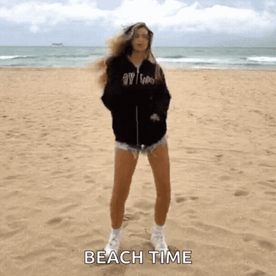 Woman Standing On Sandy Beach Saying Beach Time GIF