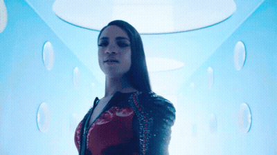 Woman Standing Under Blue Ceiling GIF