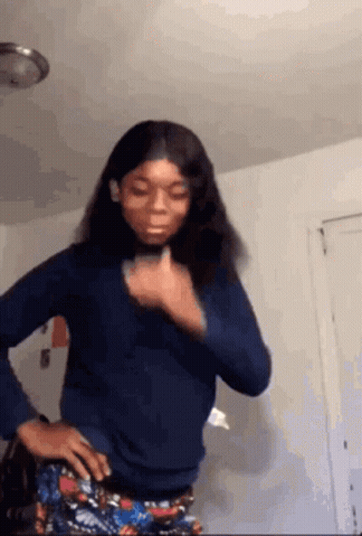 Woman Standing With Hands On Hips And Thumbs Up GIF